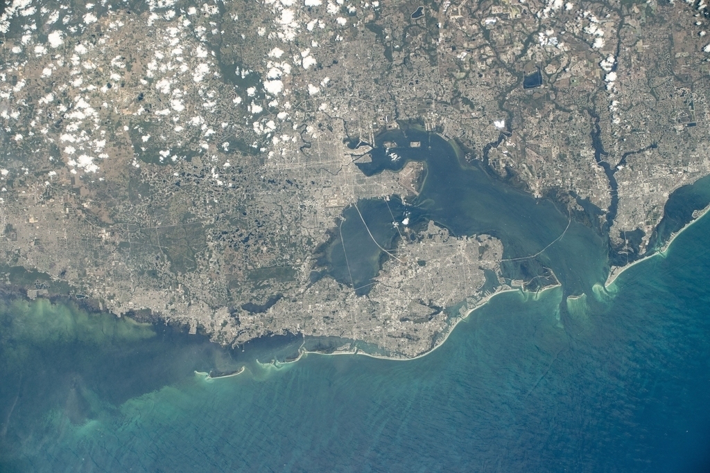 NASA Shares Photos Of Tampa Bay From Outer Space - Florida's cities of Tampa, St. Petersburg, Clearwater, and surrounding suburbs on Tampa Bay are pictured from the International Space Station as it orbited 261 miles above the Gulf of Mexico.